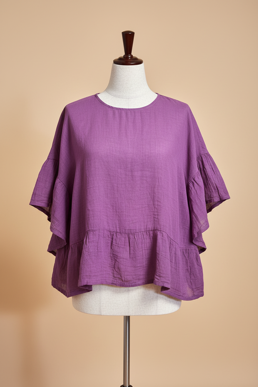 Blusa morada espalda fondo beige