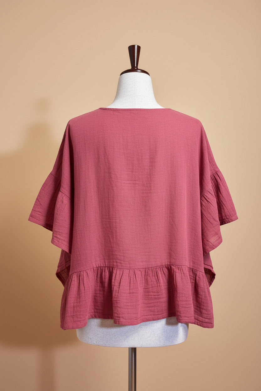 Blusa rosa espalda fondo beige