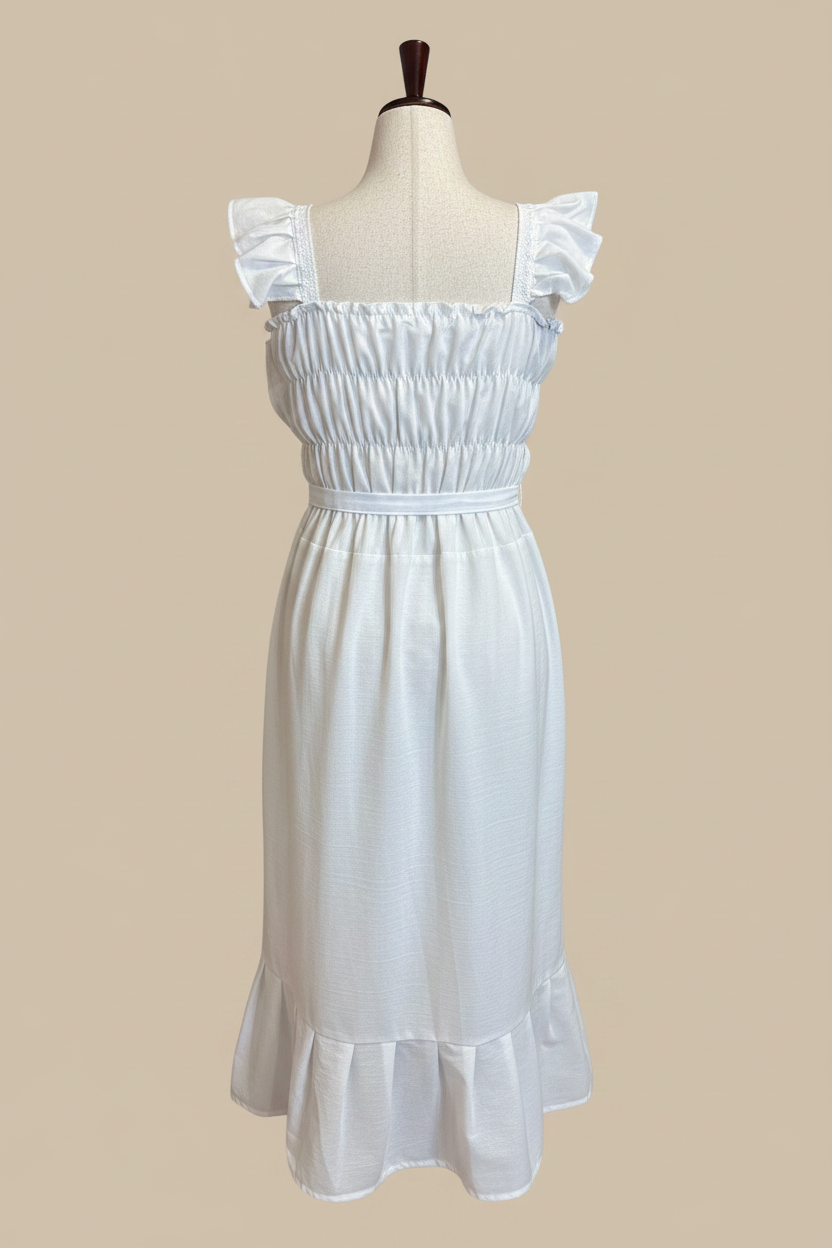 Vestido bordado - vista trasera fondo beige